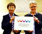 Mayor of Sendai City and UNISDR Chief present the Logo of the Conference