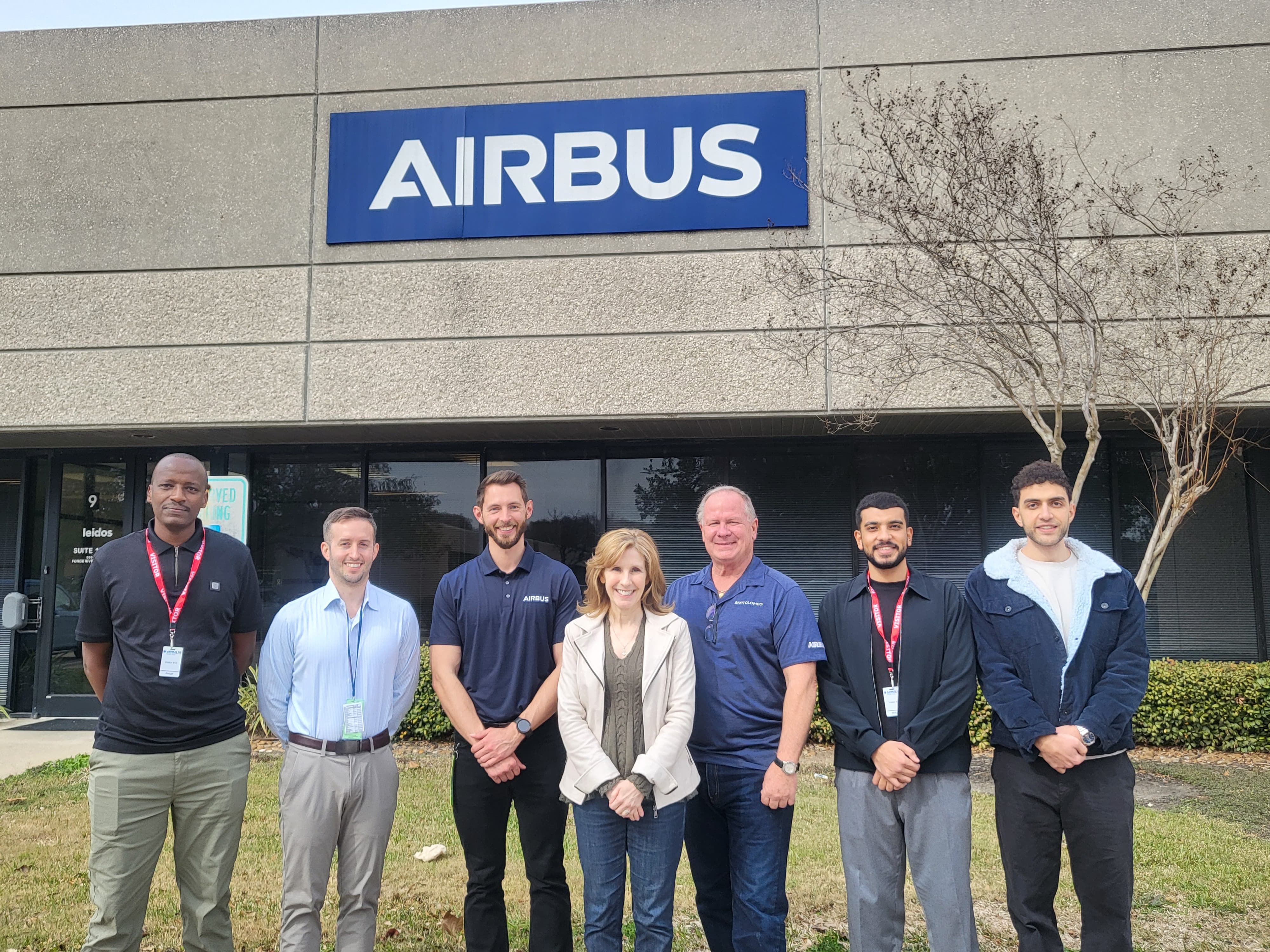 Team in Front of Airbus