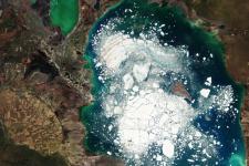 This Copernicus Sentinel-2 image shows Kazakhstan’s Alakol Lake on which large chunks of broken ice float in 5 April, 2016. Climate change threatens to disappear more than one third of Central Asia’s glaciers raising the disaster risk for vulnerable communities. Image: ESA.