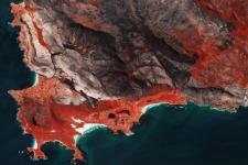 Sentinel-2 image shows burnscars near Cape Town, South Africa. The false-colour image shows burnt areas in dark greys and browns, and areas covered with vegetation in red.Image: ESA/ CC BY-SA 3.0 IGO.