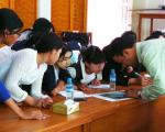 Participants are being trained in analyzing maps produced as part of International Charter activations.