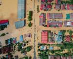 Flooded village with residential houses.