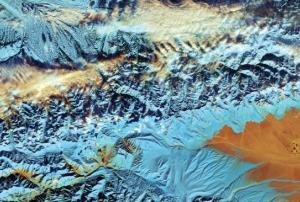 This cropped, false-colour image captured with Sentinel-2A on 18 November 2016, depicts northwestern China. Since the 1960s, the Tian Shan glaciers have lost a quarter of their ice mass and scientists estimate that they will shrink by half until 2050. The melting process of glaciers pose threats to communities living downstream. Image: ESA. 