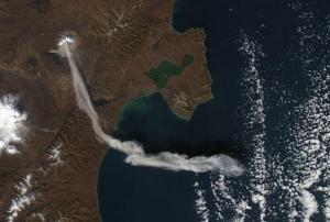 An image of the Sheveluch (Shiveluch) volcano in Kamchatka, Russian Federation emitting an ash plume taken by NASA’s Aqua satellite in 2012. Image: NASA Earth Observatory.