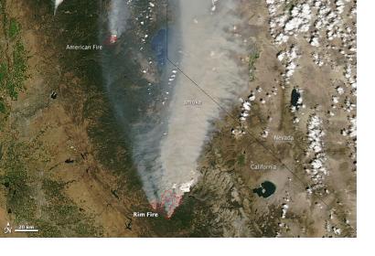 Red outlines represent hot spots where MODIS detected unusually warm temperature