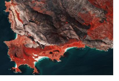 Sentinel-2 image shows burnscars near Cape Town, South Africa. The false-colour image shows burnt areas in dark greys and browns, and areas covered with vegetation in red.Image: ESA/ CC BY-SA 3.0 IGO.