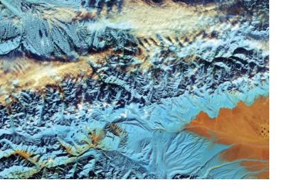 This cropped, false-colour image captured with Sentinel-2A on 18 November 2016, depicts northwestern China. Since the 1960s, the Tian Shan glaciers have lost a quarter of their ice mass and scientists estimate that they will shrink by half until 2050. The melting process of glaciers pose threats to communities living downstream. Image: ESA. 