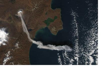 An image of the Sheveluch (Shiveluch) volcano in Kamchatka, Russian Federation emitting an ash plume taken by NASA’s Aqua satellite in 2012. Image: NASA Earth Observatory.