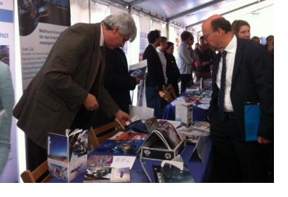 Minister Lersch-Mense of North Rhine Westphalia visiting the UN-SPIDER stand