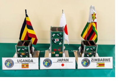 BIRDS-5 satellite constellation developed by Uganda, Zimbabwe, and Japan sits on table prior to launch.