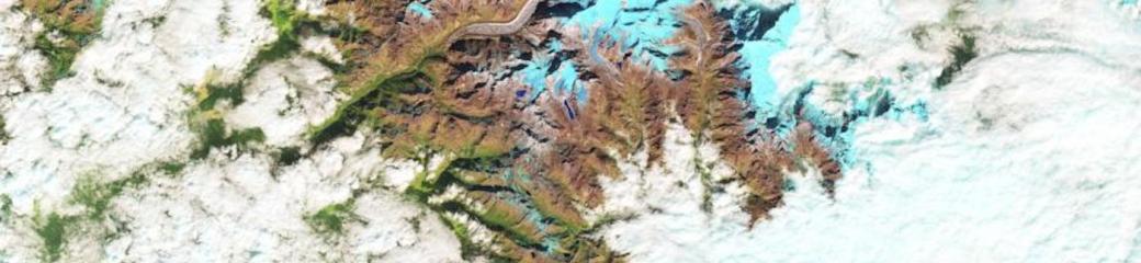 The false-color images above show a glacial lake in the Himalayas nearly doubling in length over 30 years. Ice is represented as light blue, while significant meltwater is dark blue. Rocks are brown; vegetation is green. The growth of glacial lakes can increase the risk of flooding in nearby valleys. Image: NASA.